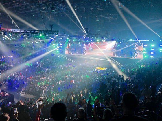 The arena crowd standing under stage lighting at PHP Lights Out 2026
