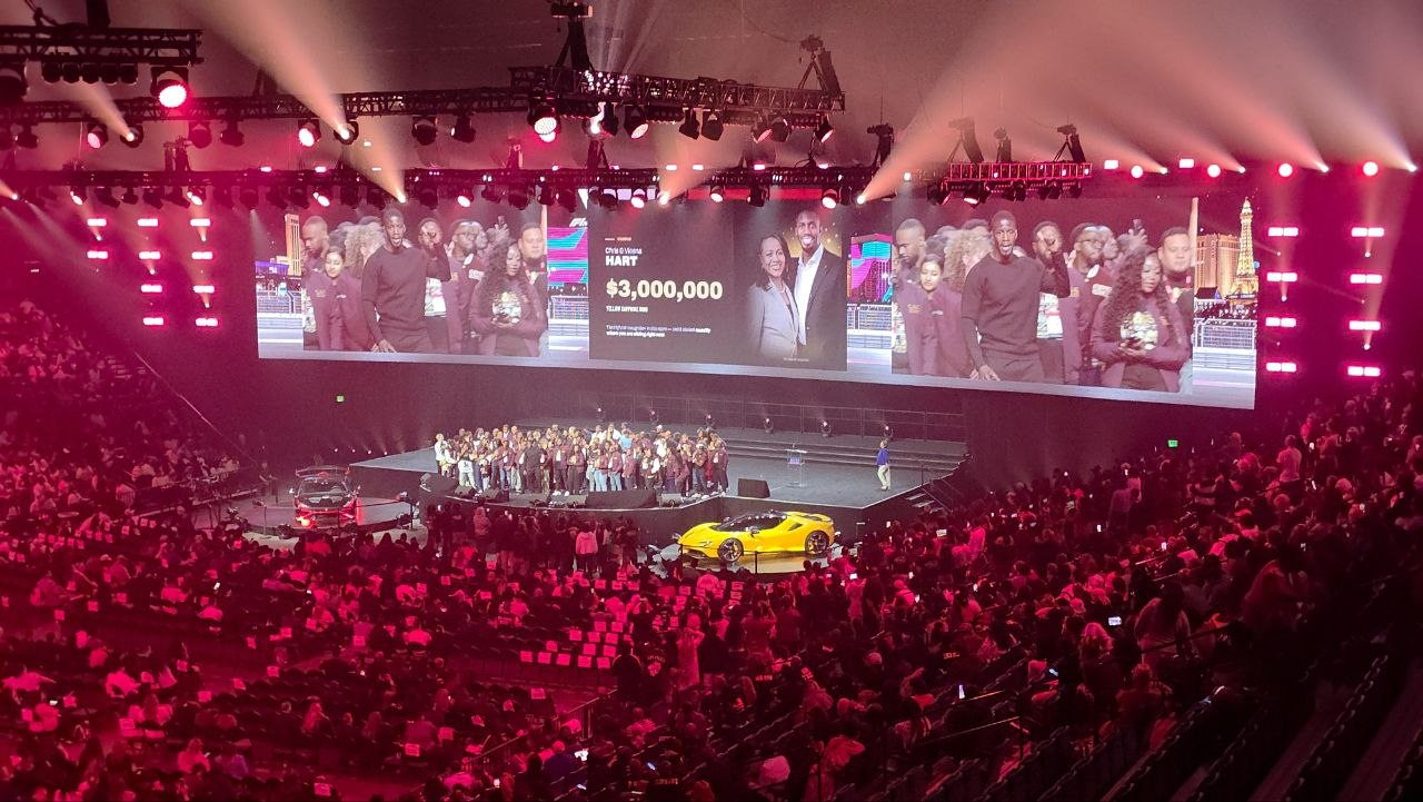 The PHP Lights Out 2026 main stage with Chris Hart and $3,000,000 displayed on the arena screen above a packed crowd