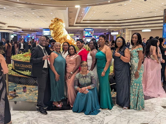 A group of BTT team members posing at the MGM Grand in Las Vegas during the PHP Lights Out gala