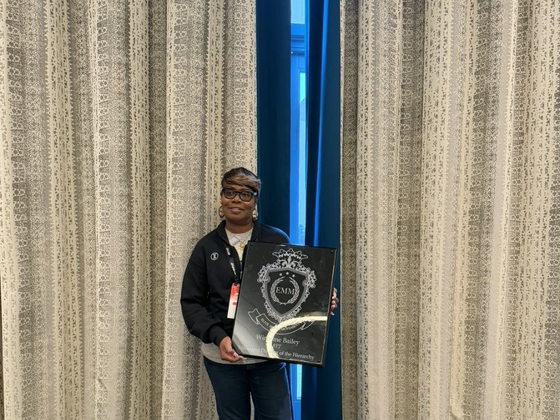 Winsome Bailey holding her Elite Money Movement plaque at PHP Lights Out 2026
