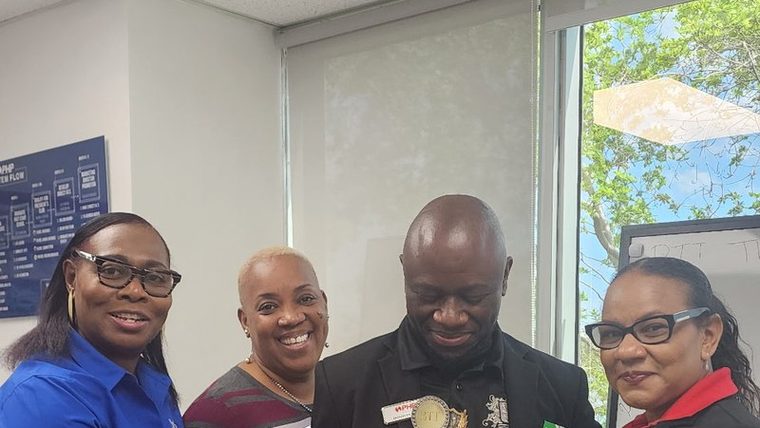 BTT team members receiving awards in the Pompano Beach office