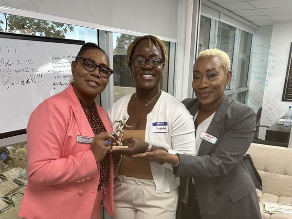 A trophy handed over in person in the office